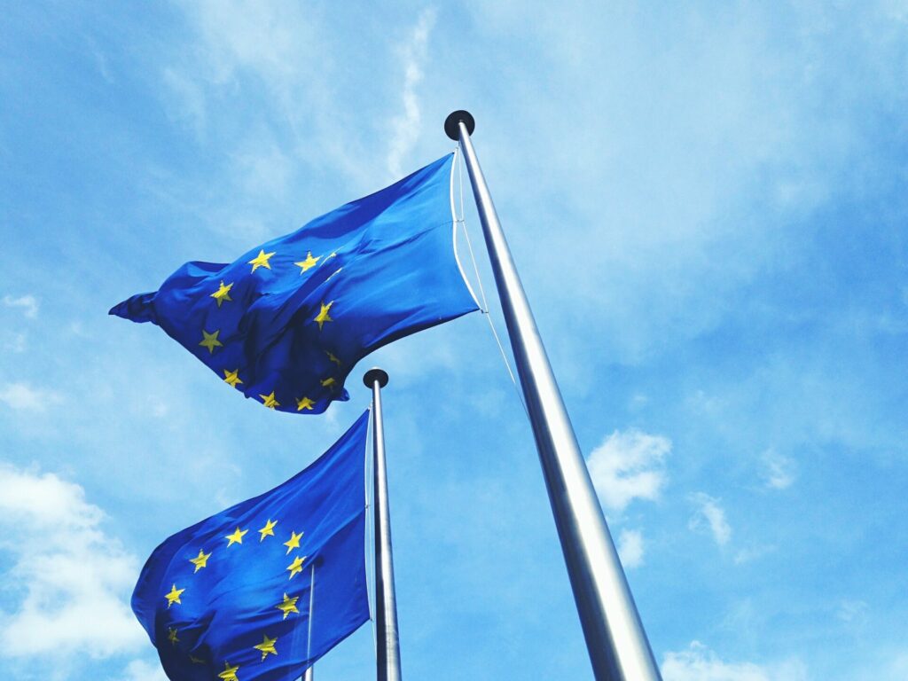European union flag flying against blue sky
